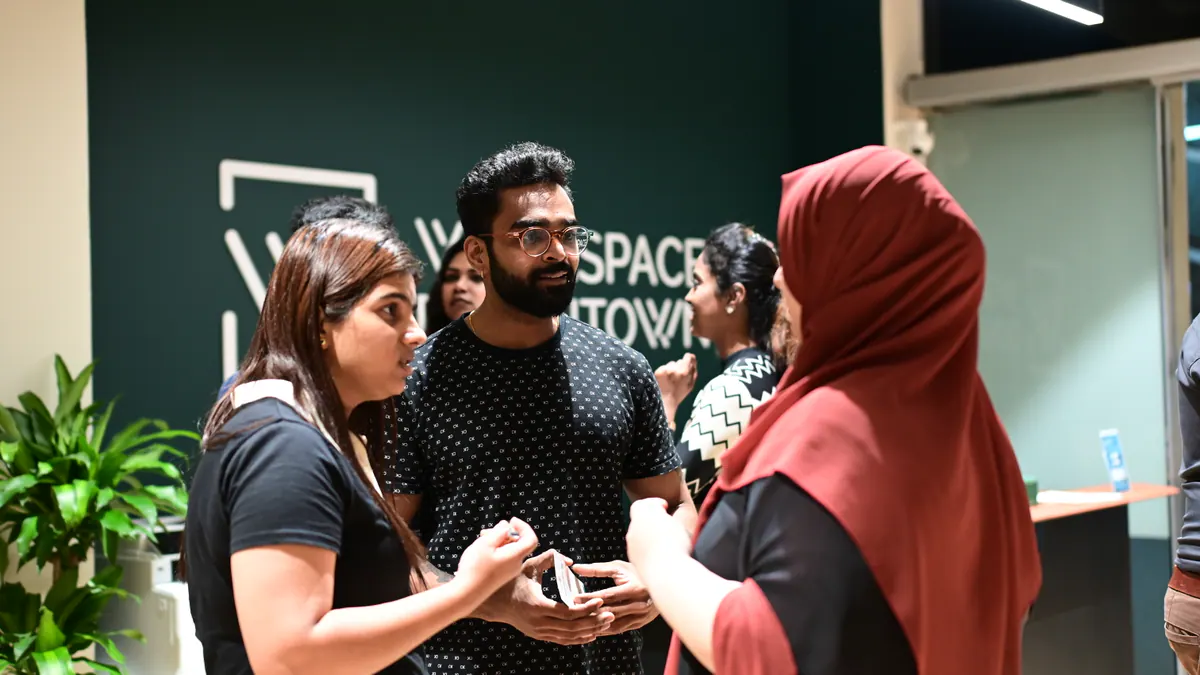 Founders in a focused conversation at a Global Syndicate gathering