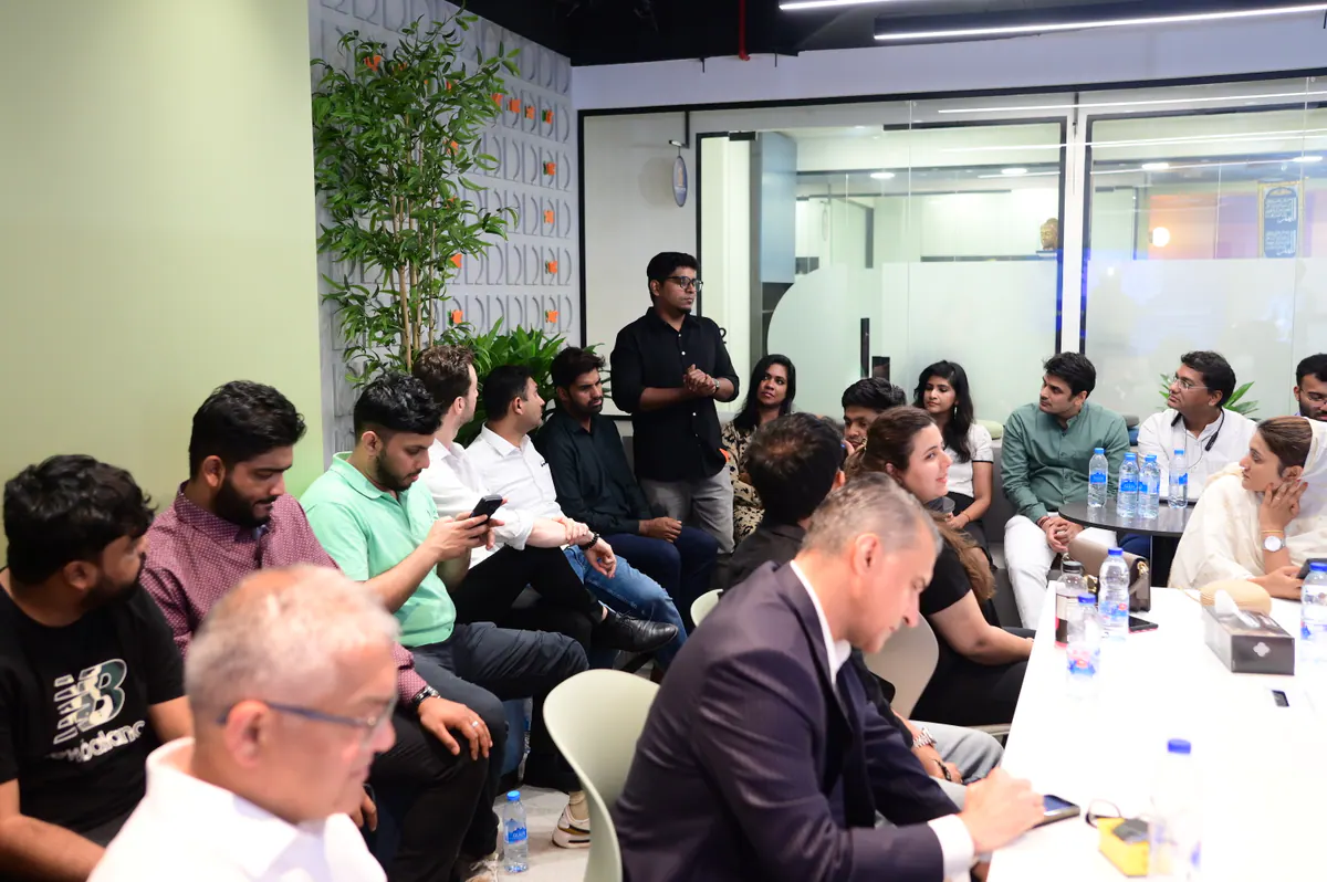 Founders exchanging perspectives during a focused boardroom discussion