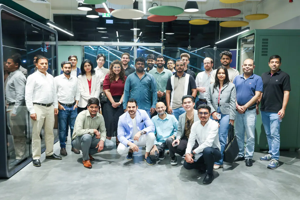 A diverse Global Syndicate founder group in a modern Dubai venue